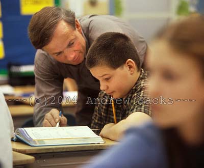 Elementary school teacher helps math class