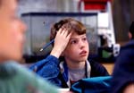 Boy listens in elementary classroom