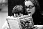 riana Oughton
Reading to a child in headstart program.