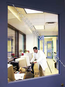 Medical researcher at computer station
