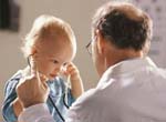 Male pediatrician with child 